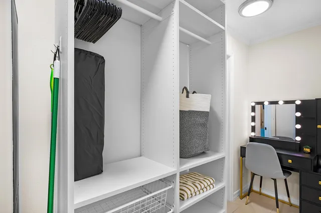 a view of kitchen with furniture and a potted plant
