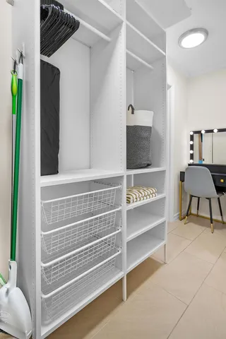 a view of room with a flat screen tv and stairs