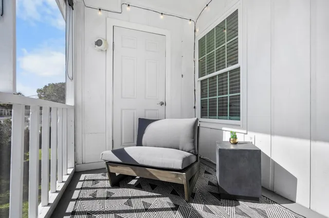 a outdoor living space with furniture and a window
