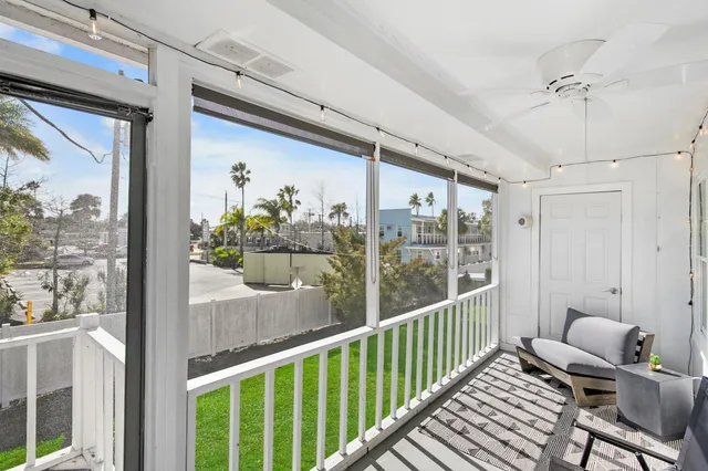 a view of a balcony with chairs