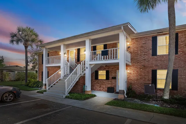 a front view of building with yard