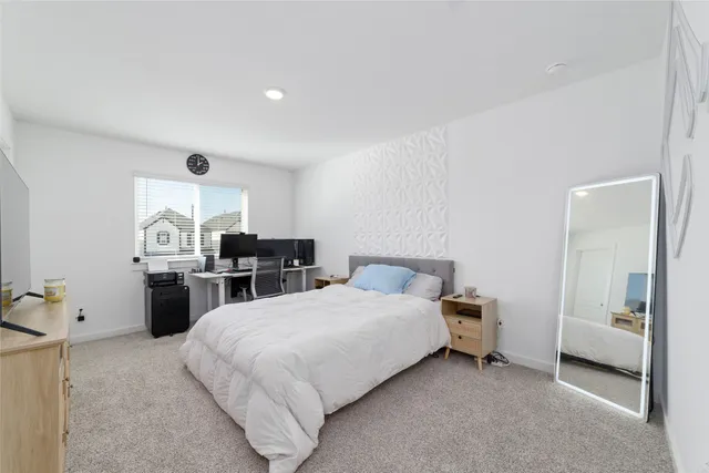 a bedroom with bed and a dresser