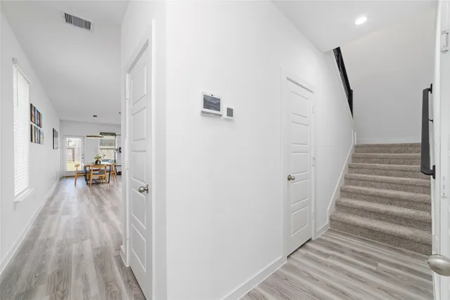 a view of a living room and entryway