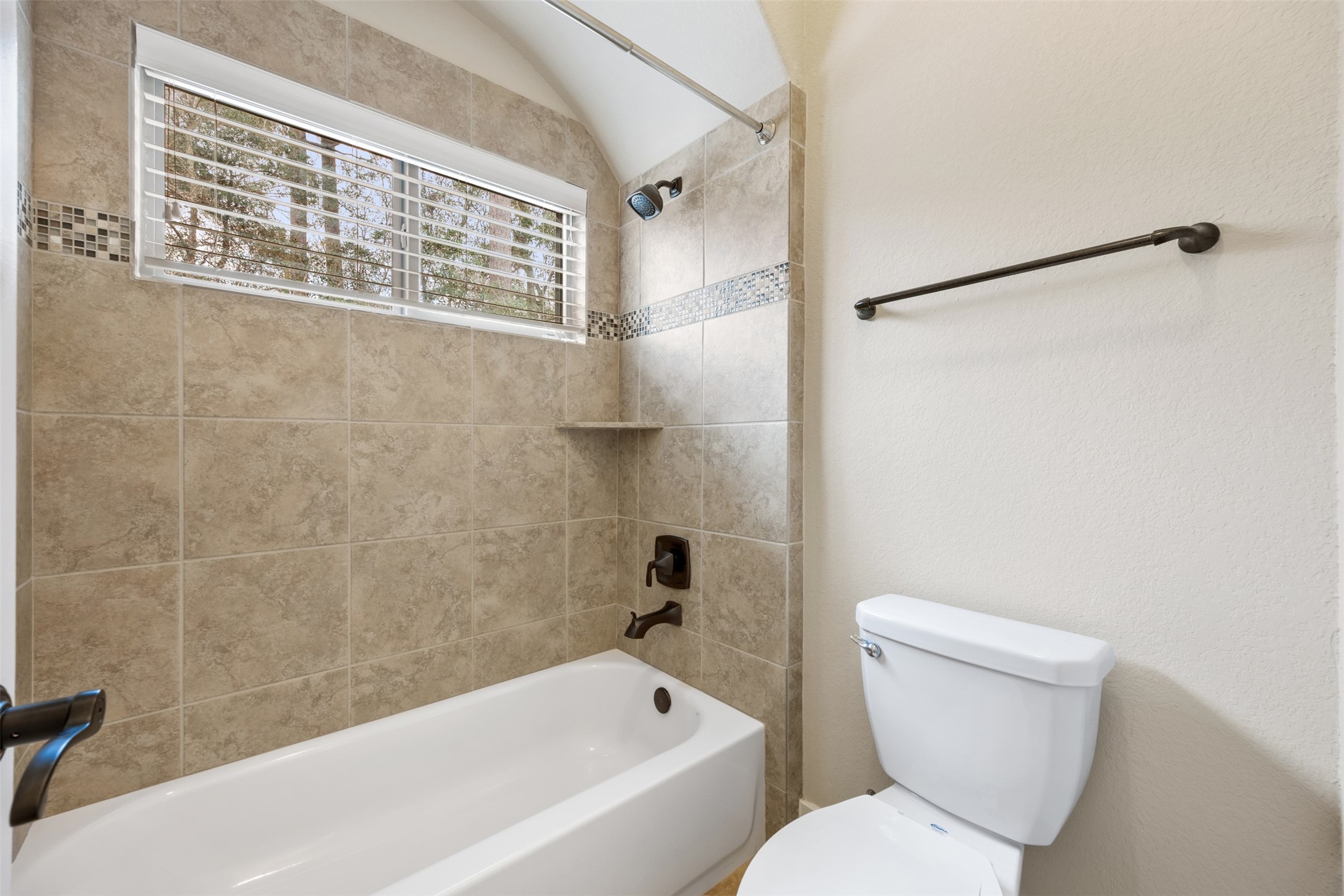 6515 Fraser Point Spring, TX 77379 - Photo 14 of 39 a bathroom with a toilet and a bathtub