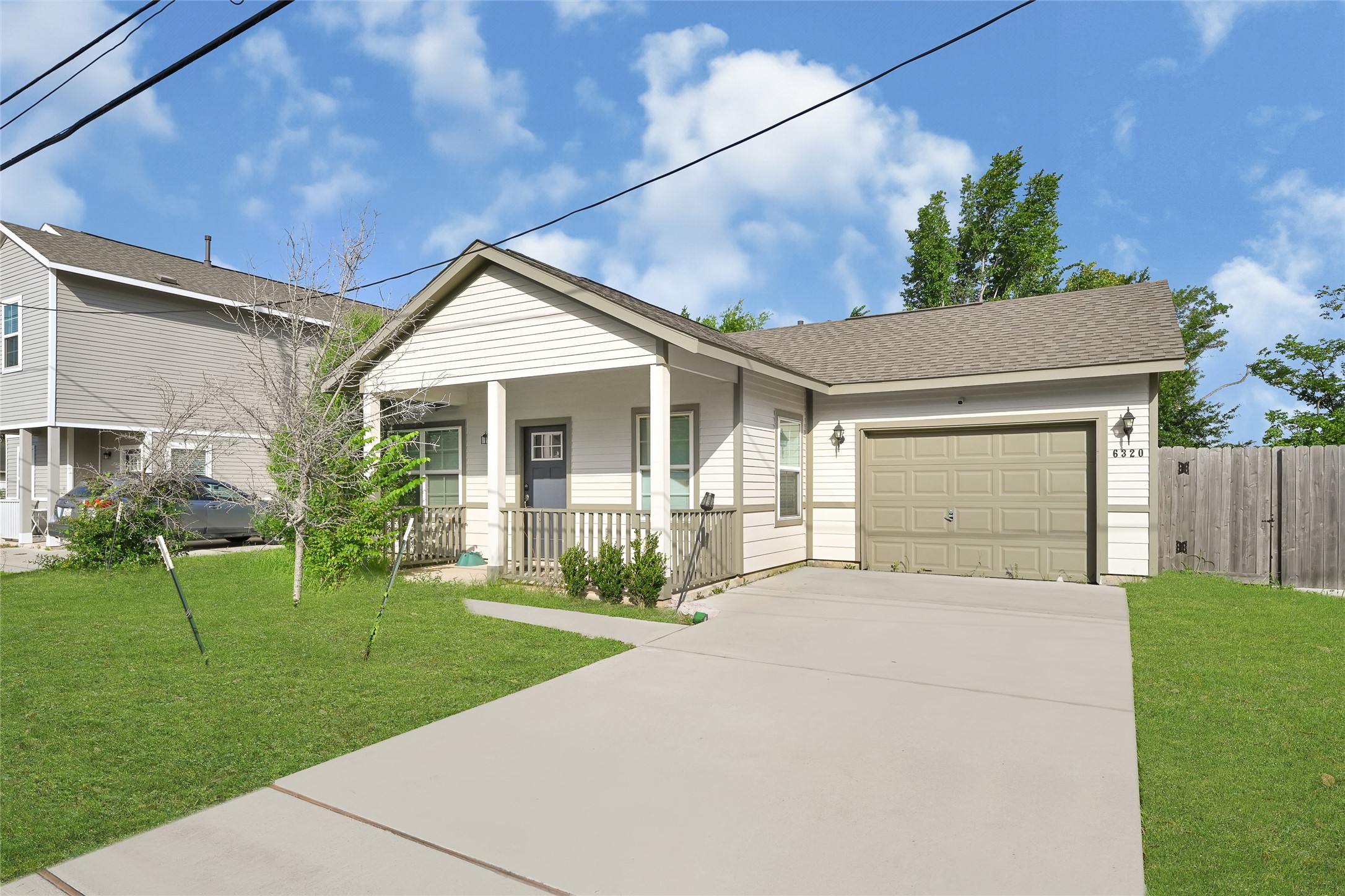 6320 Paris Street Houston, TX 77021 - Photo 1 of 16 a front view of a house with a yard and garage