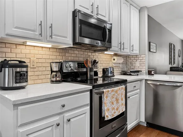 a view of a dining room with furniture and window
