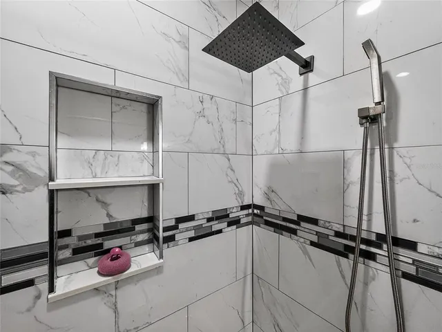 a view of a chairs and table in patio with wooden floor