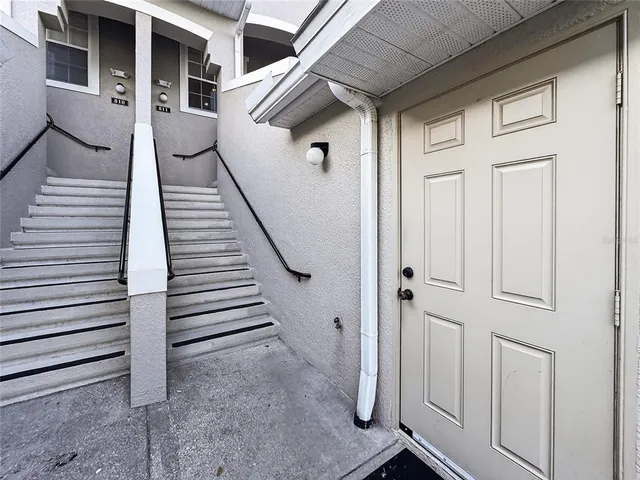 a view of a white house with a large windows