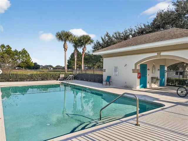 a view of a swimming pool with a lounge chairs