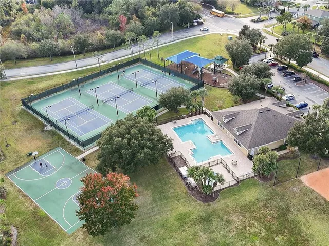an aerial view of multi story residential apartment building with yard