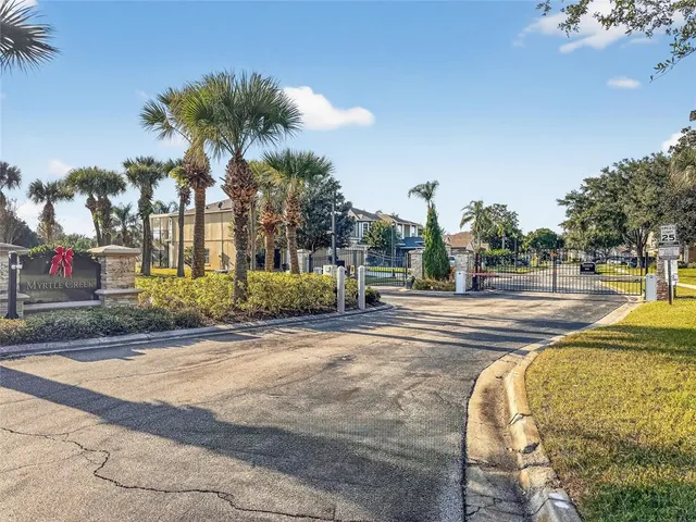 a view of outdoor space with signage and flags