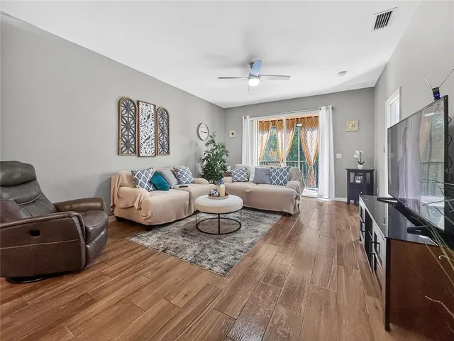 a living room with furniture and a large window