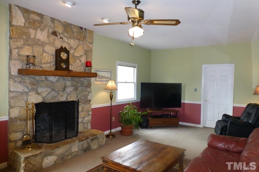 233 Henry Road Burlington, NC 27215 - Photo 5 of 25 Floor-to-ceiling stone fireplace with gas logs