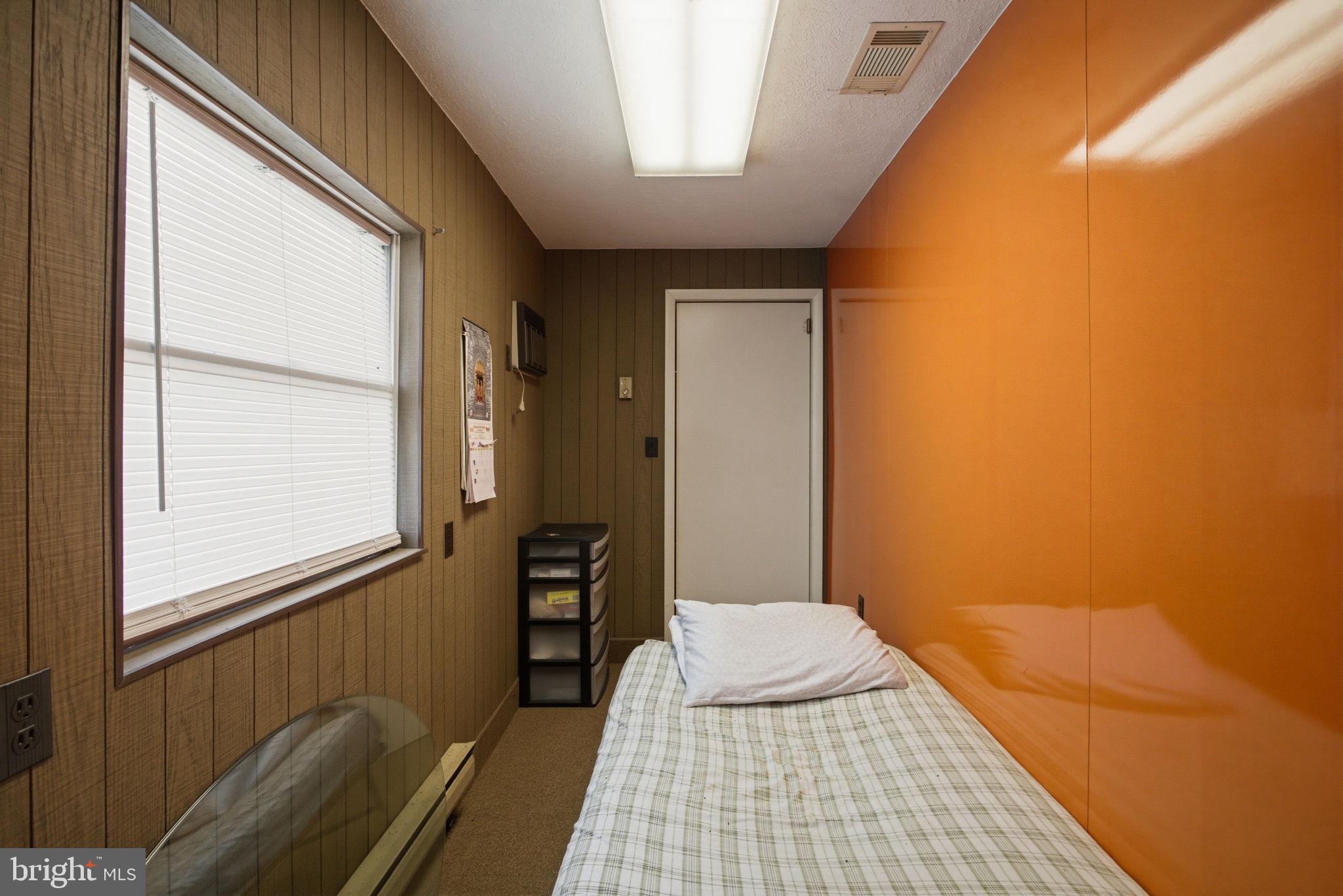 501 South Breezewood Road Breezewood, PA 15533 - Photo 26 of 43 a bedroom with a bed and a window