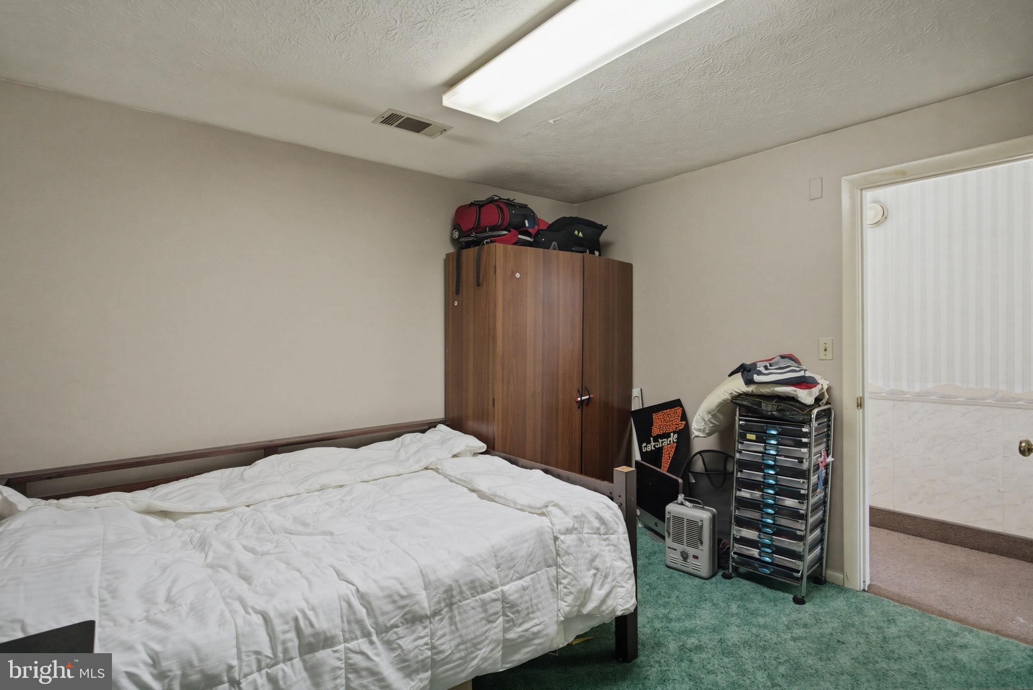 501 South Breezewood Road Breezewood, PA 15533 - Photo 27 of 43 a bedroom with a bed and a walk in closet