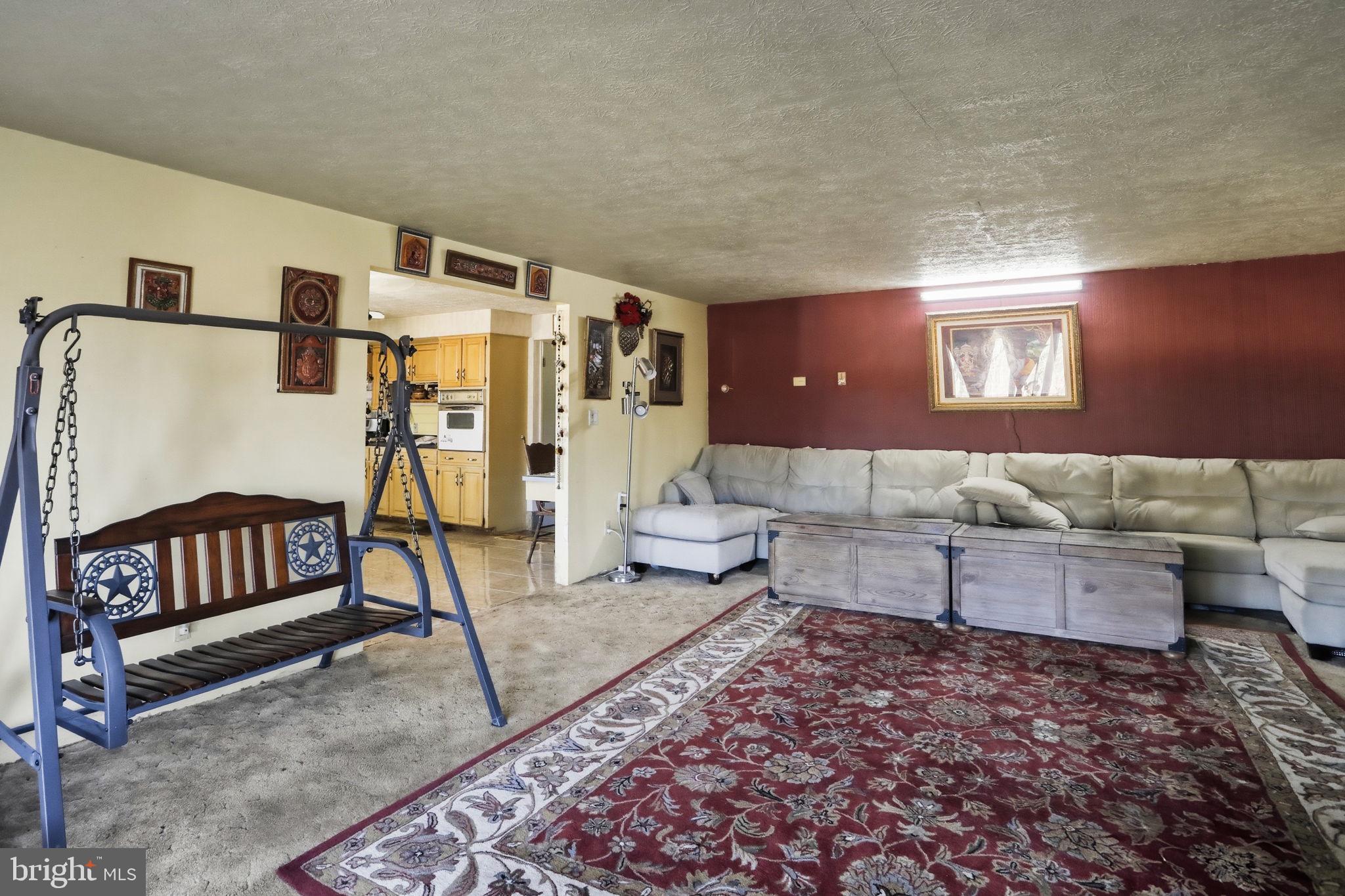 501 South Breezewood Road Breezewood, PA 15533 - Photo 32 of 43 a living room with furniture and a rug