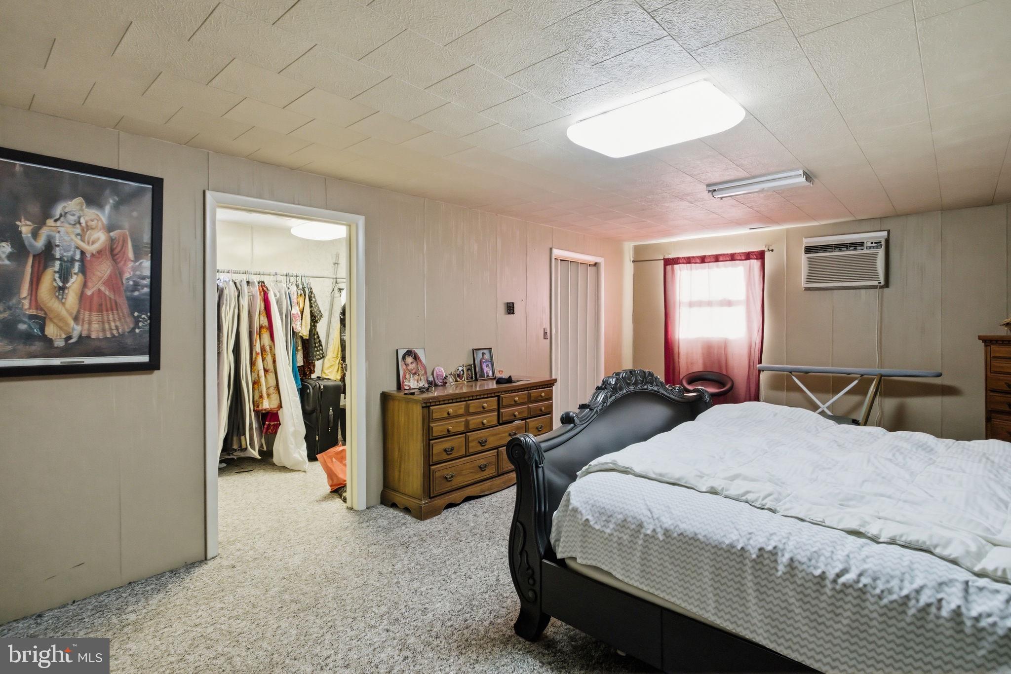 501 South Breezewood Road Breezewood, PA 15533 - Photo 40 of 43 a bedroom with a bed and a large mirror