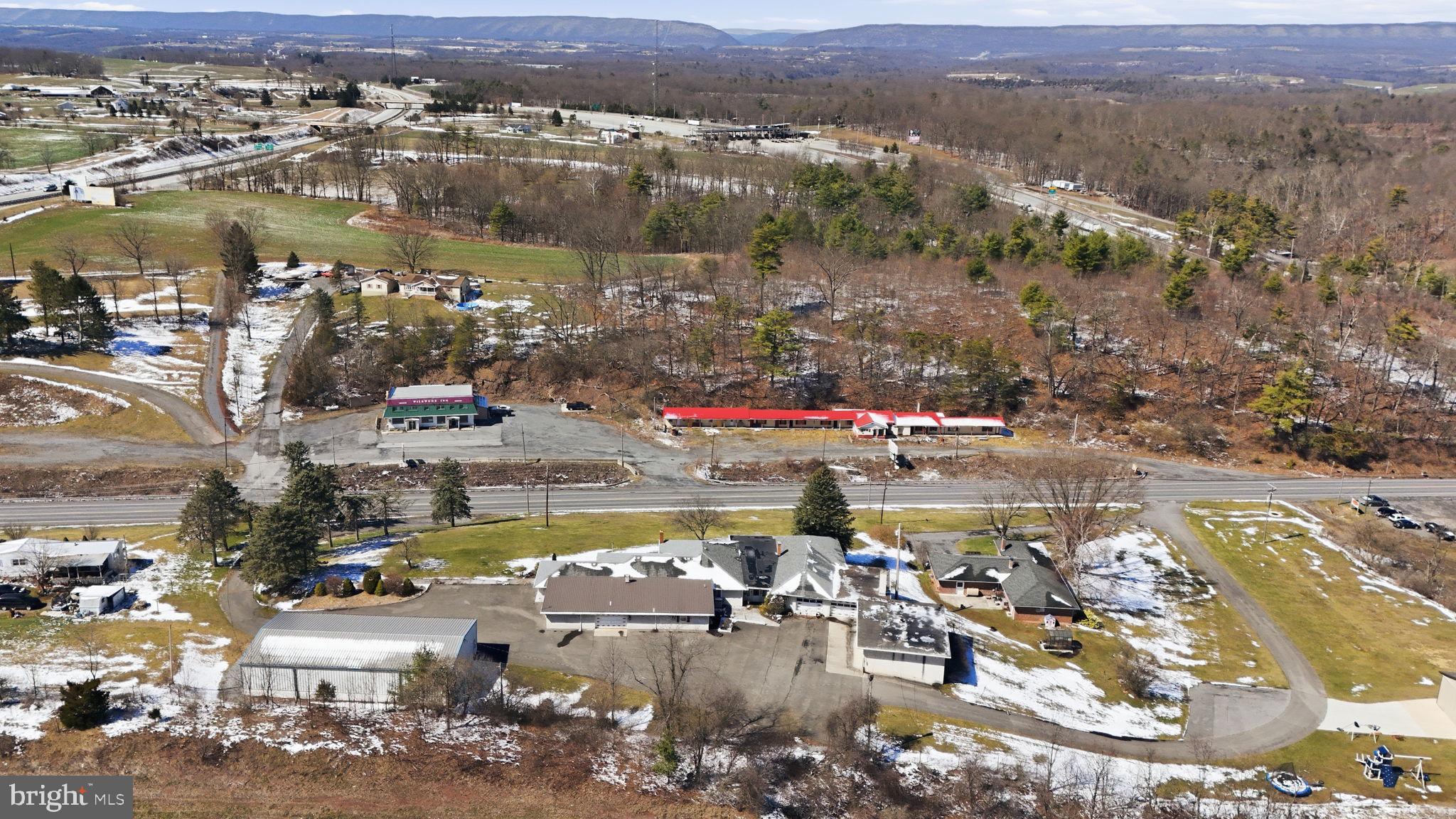 501 South Breezewood Road Breezewood, PA 15533 - Photo 9 of 43 an aerial view of residential houses with outdoor space