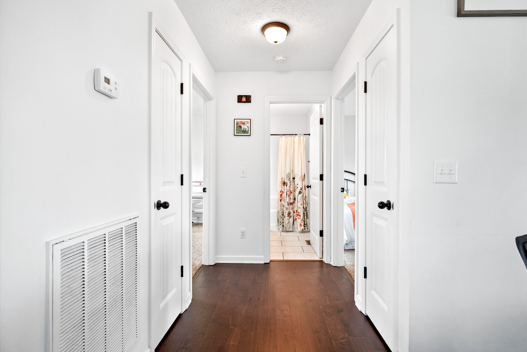 1010 Gil Hodges Road Portland, TN 37148 - Photo 14 of 22 a view of a hallway with wooden floor