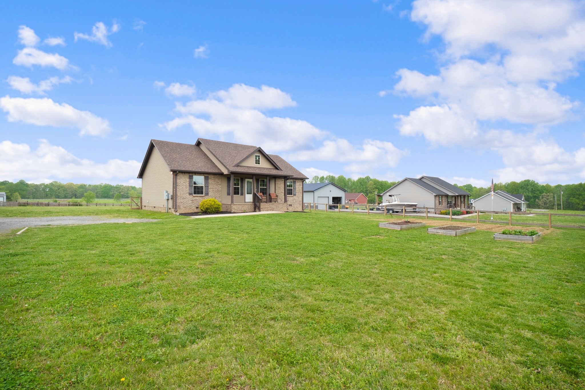 1010 Gil Hodges Road Portland, TN 37148 - Photo 3 of 22 a front view of a house with garden