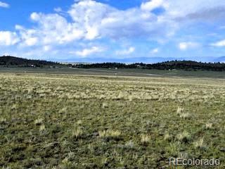 599 Summit Road Hartsel, CO 80449 - Photo 2 of 9 a view of a lake from a yard