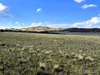599 Summit Road Hartsel, CO 80449 - Photo 3 of 9 a view of a lake from a mountain