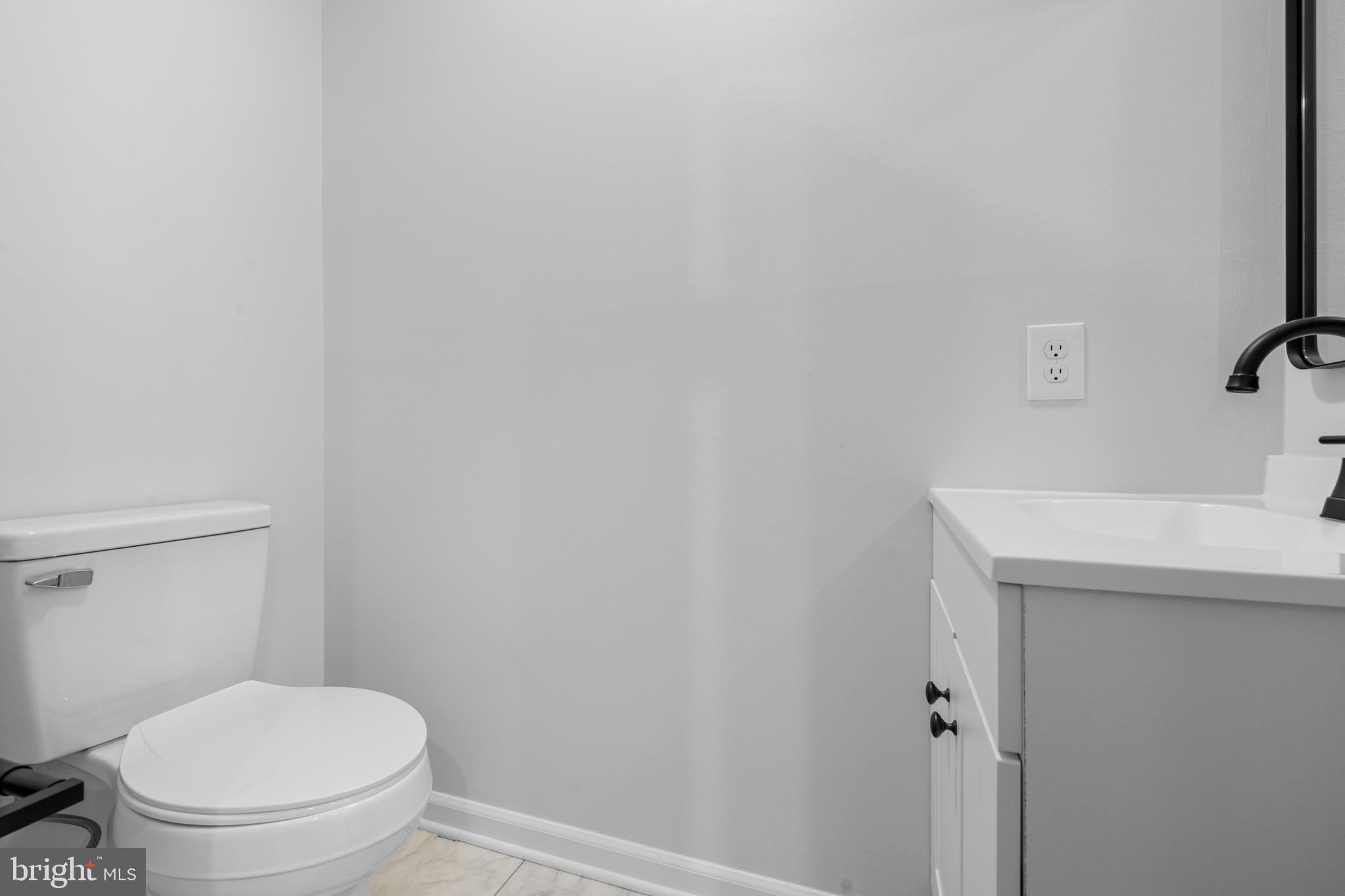 6912 Stratford Drive Sykesville, MD 21784 - Photo 14 of 46 a white toilet sitting next to a white sink