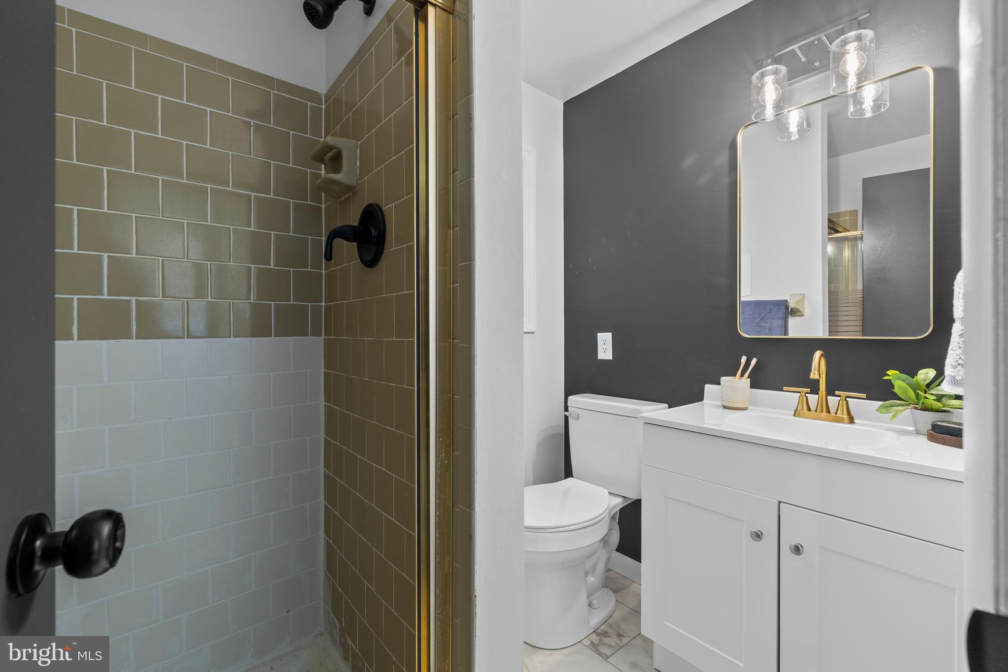 6912 Stratford Drive Sykesville, MD 21784 - Photo 27 of 46 a bathroom with a toilet sink a shower and