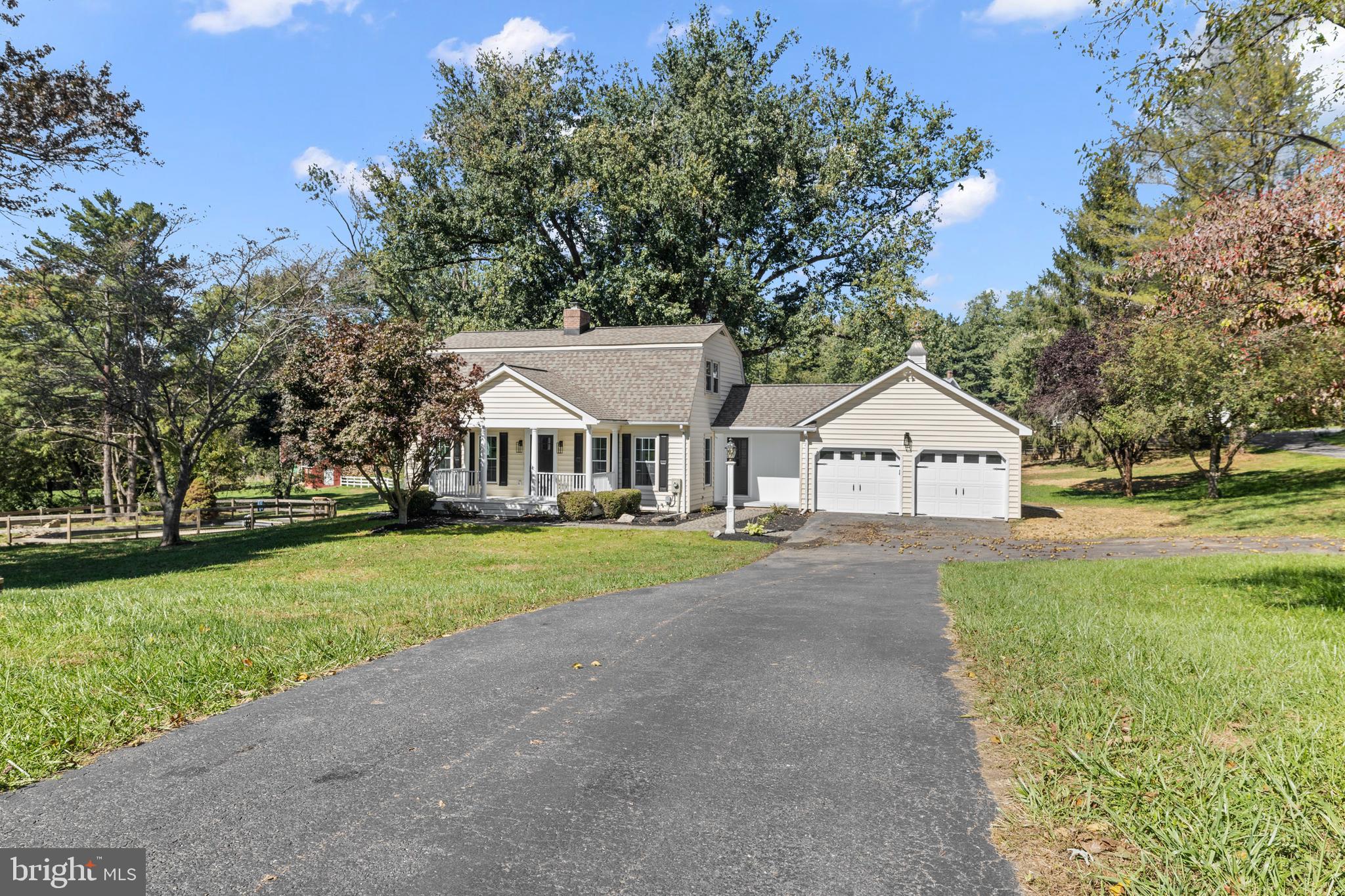 6912 Stratford Drive Sykesville, MD 21784 - Photo 33 of 46 a view of house with garden and trees