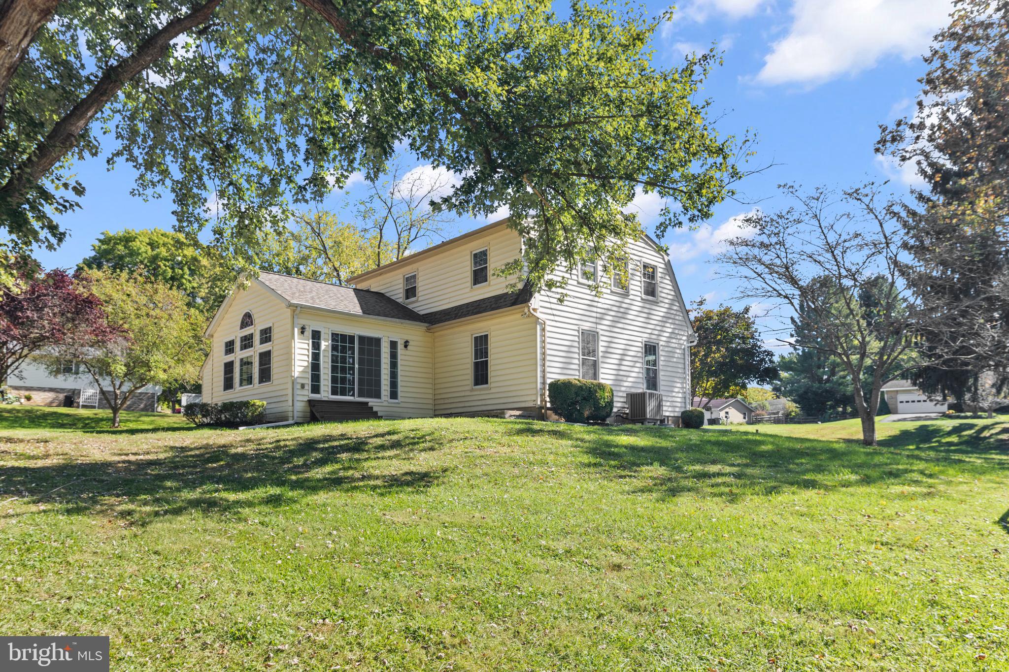 6912 Stratford Drive Sykesville, MD 21784 - Photo 38 of 46 a view of a house with a big yard and large trees