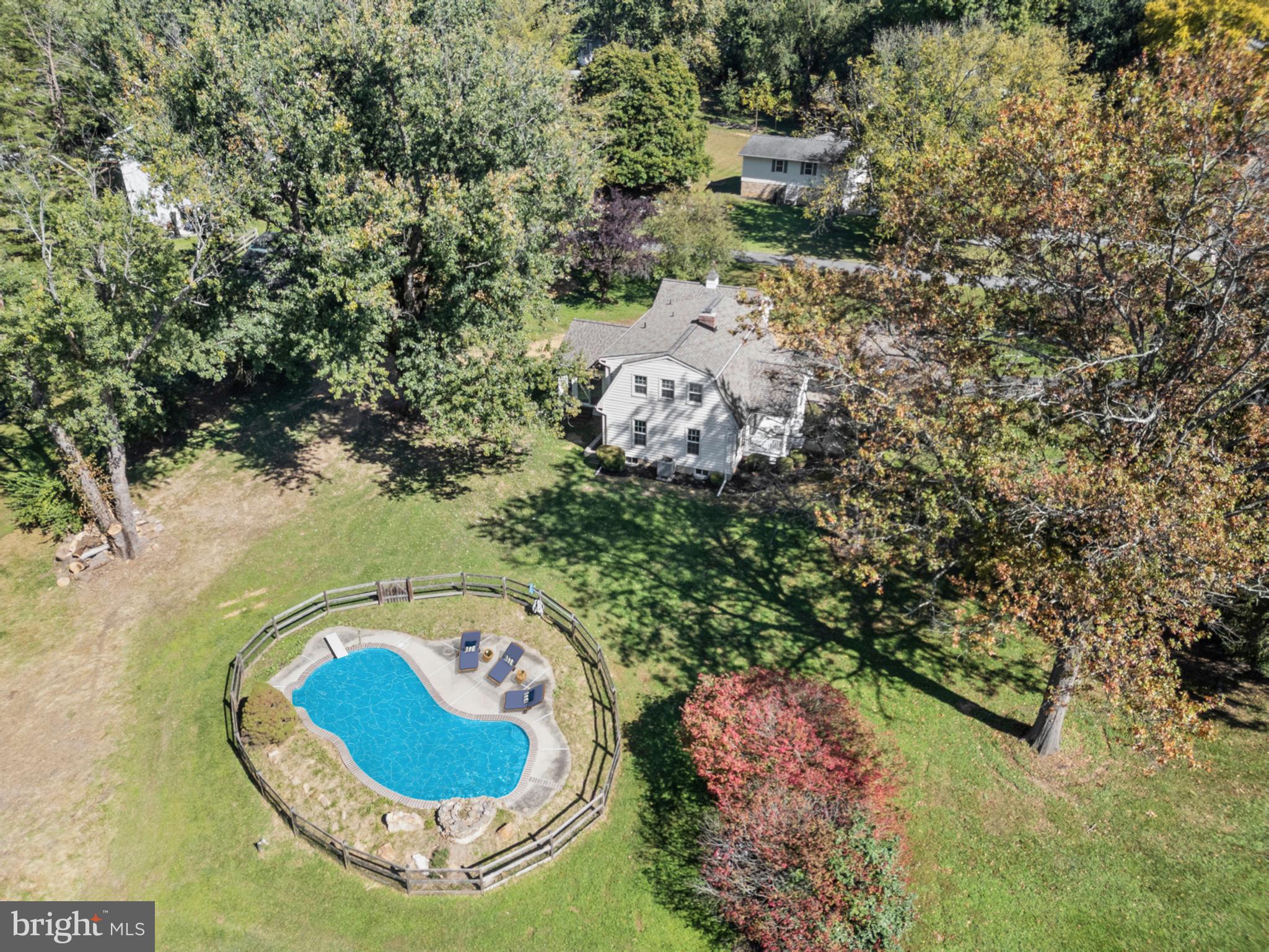 6912 Stratford Drive Sykesville, MD 21784 - Photo 43 of 46 an aerial view of a house with a swimming pool