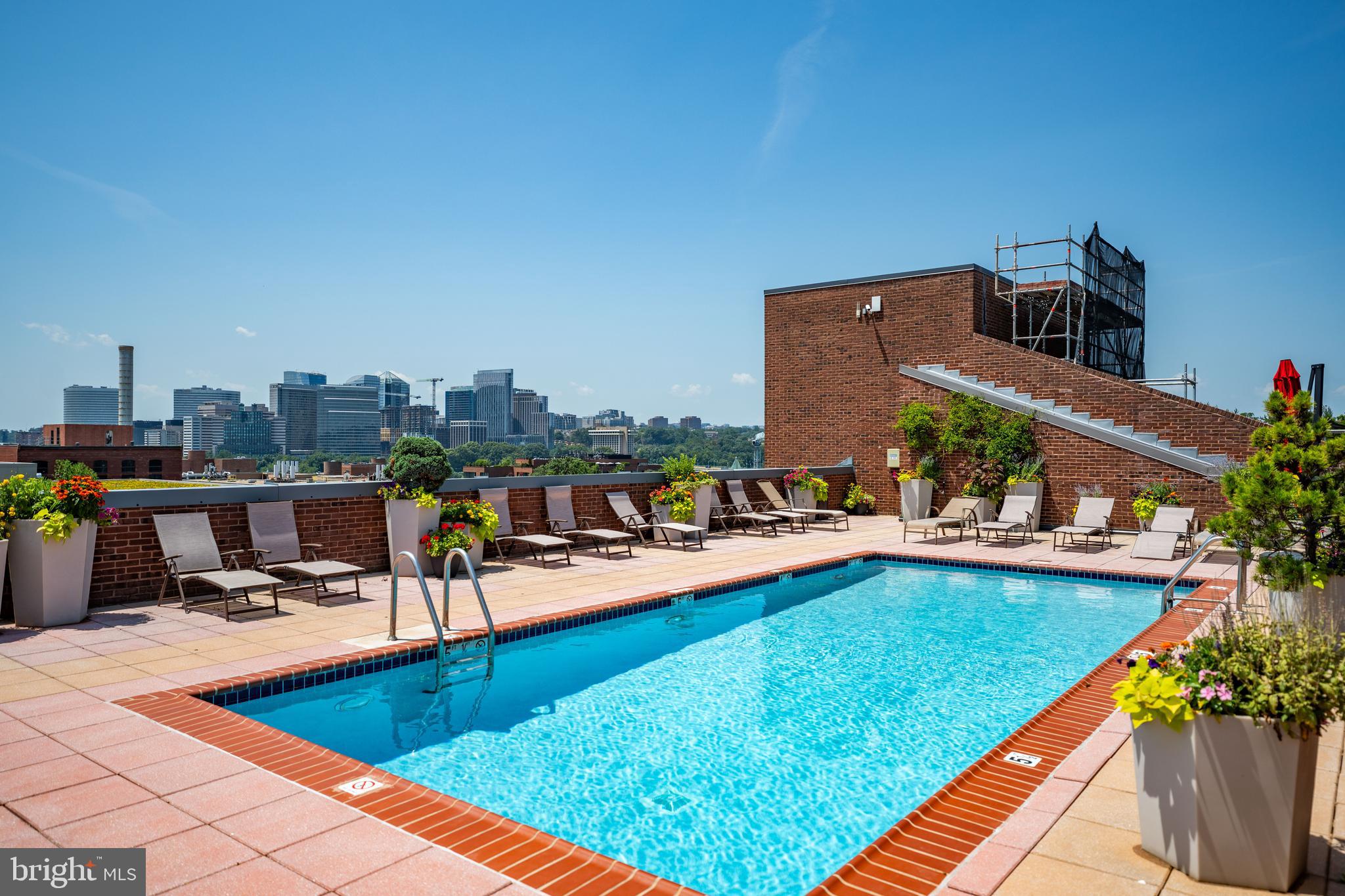 3251 Prospect Street Northwest, Unit 313 Washington, DC 20007 - Photo 1 of 43 a view of a swimming pool with chairs