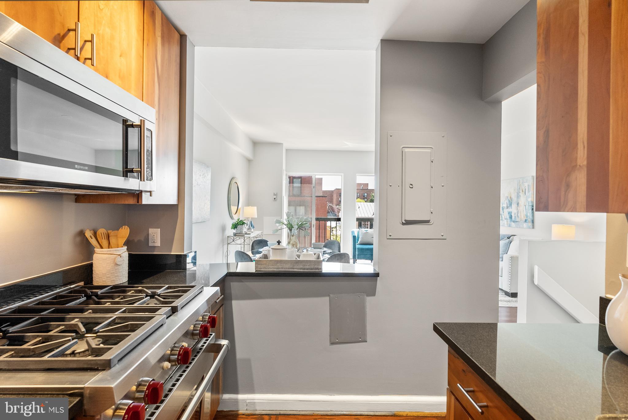 3251 Prospect Street Northwest, Unit 313 Washington, DC 20007 - Photo 15 of 43 a kitchen with stainless steel appliances a stove a sink and a refrigerator