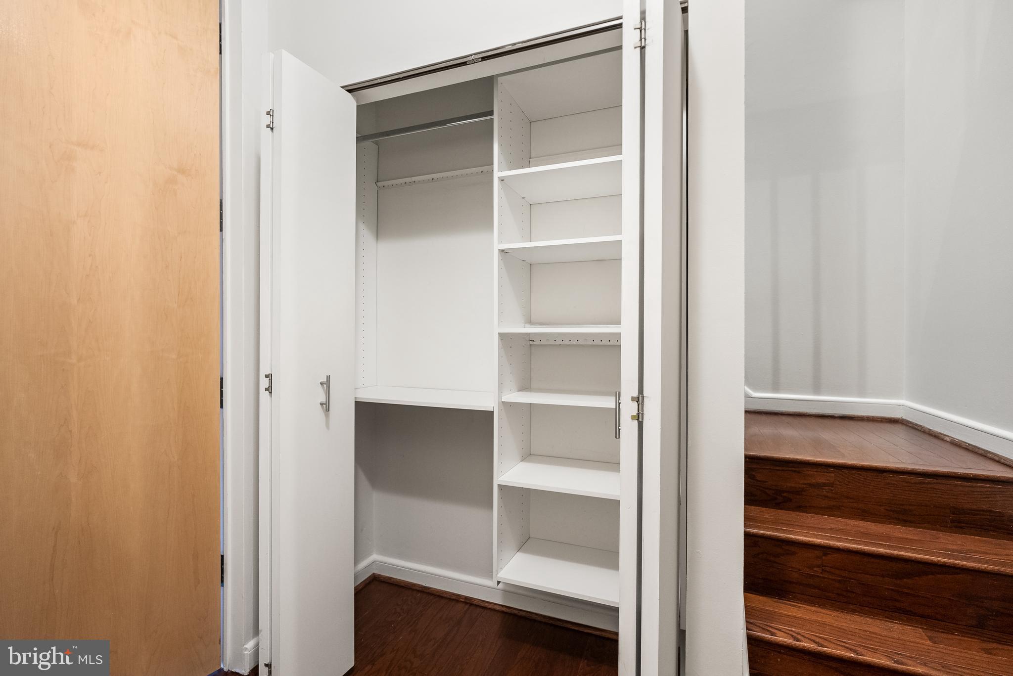 3251 Prospect Street Northwest, Unit 313 Washington, DC 20007 - Photo 18 of 43 a view of walk in closet with empty racks