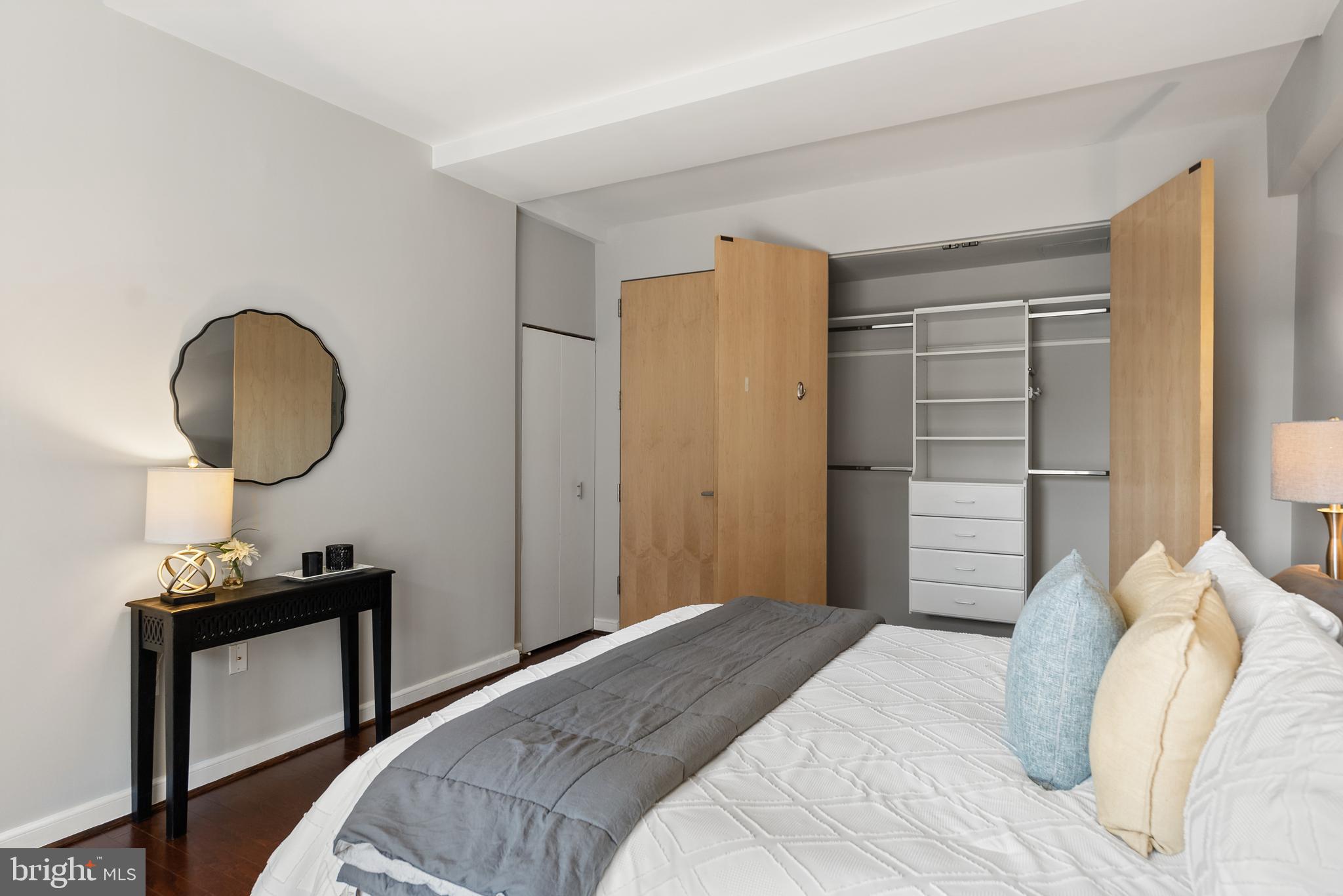 3251 Prospect Street Northwest, Unit 313 Washington, DC 20007 - Photo 21 of 43 a bedroom with a bed and a mirror