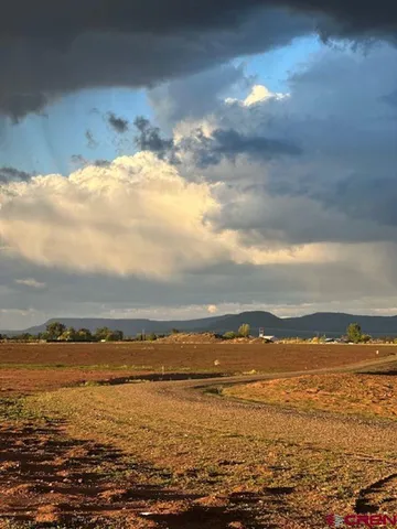 a view of an ocean with mountain