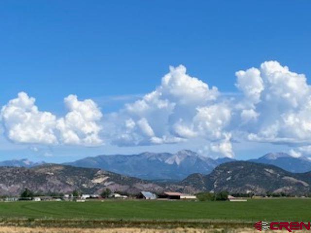 Lot 17 Entrada Del Sol Durango, CO 81303 - Photo 3 of 19 a view of a lake in middle of forest