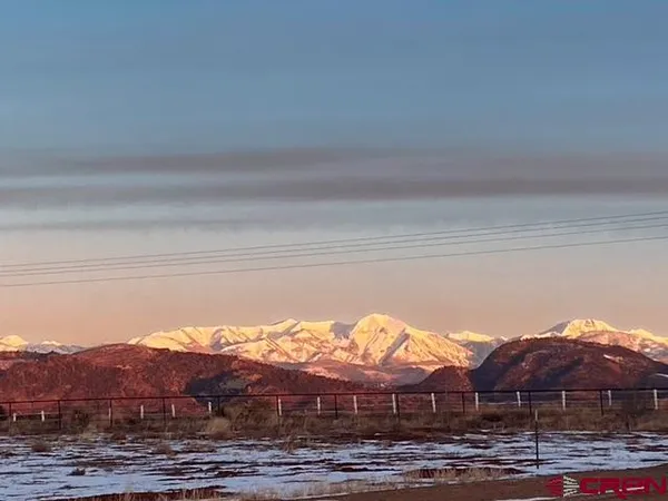 a view of a house with a yard and balcony
