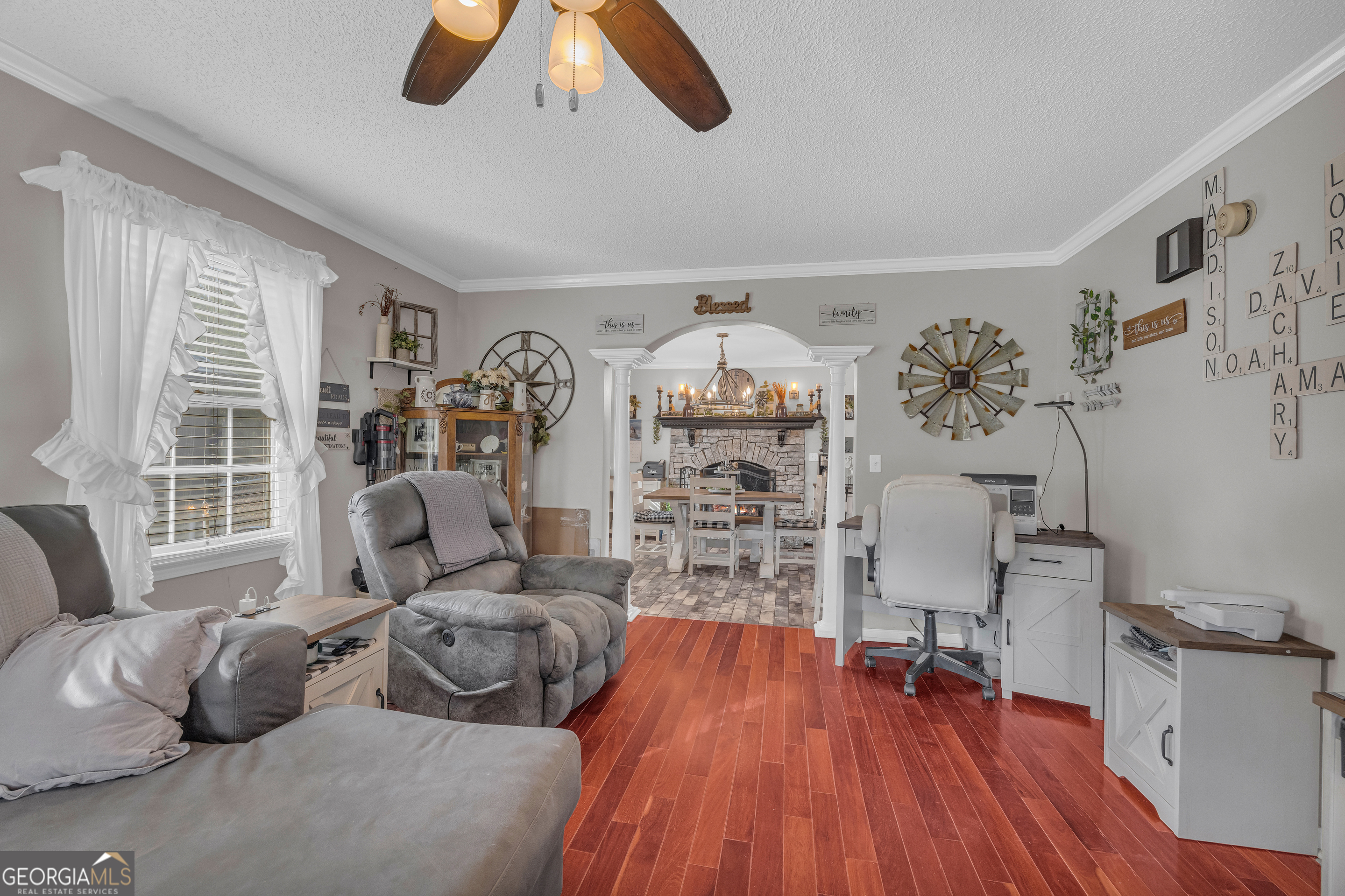 340 Riverbend Circle Royston, GA 30662 - Photo 19 of 108 a living room with furniture and a wooden floor
