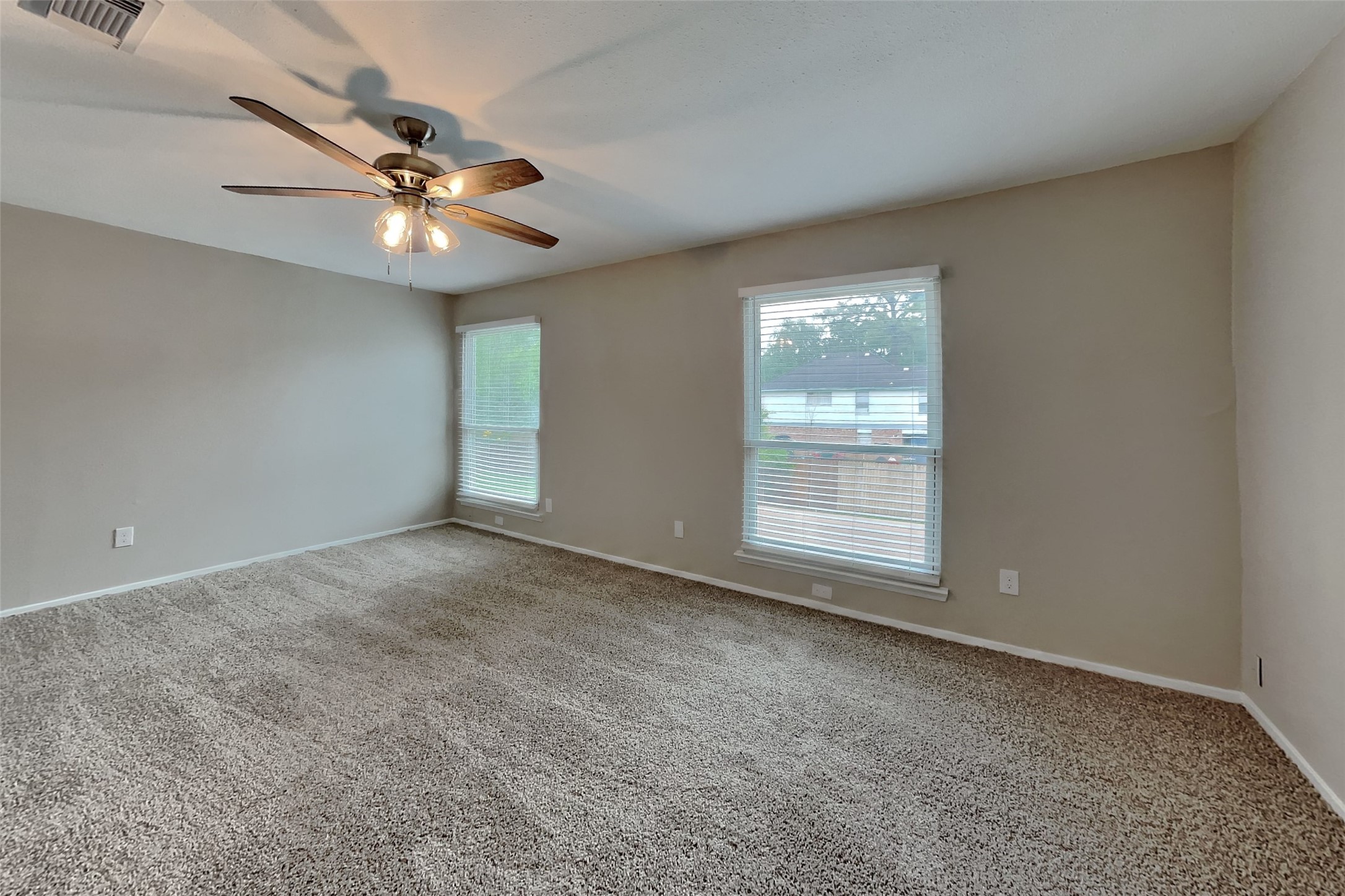 10015 Rippling Fields Drive Houston, TX 77064 - Photo 10 of 24 a view of an empty room with a window