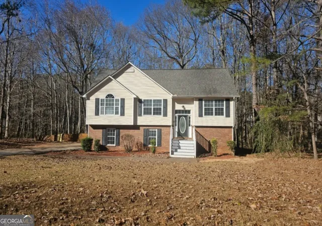 a front view of a house with a yard