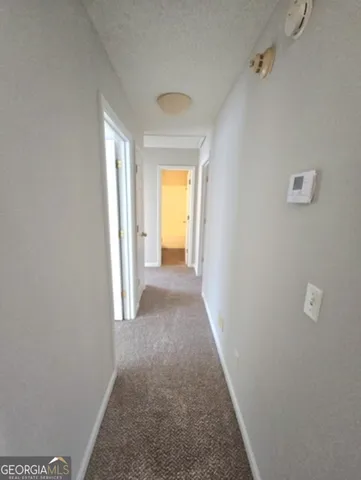 a view of a hallway with a window