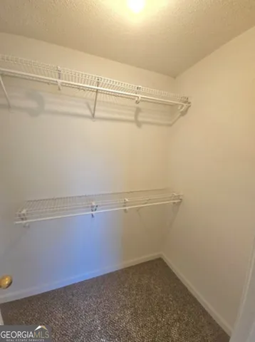 a view of a room with racks on the wall