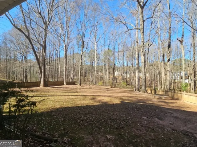 a view of outdoor space with deck and yard