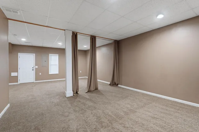 an empty room with a bathroom