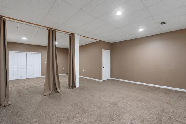 a view of yard with a car parked