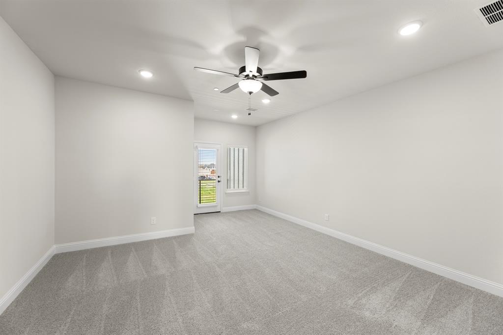3916 Keya Drive Prosper, TX 75078 - Photo 20 of 28 an empty room with a window and a ceiling fan