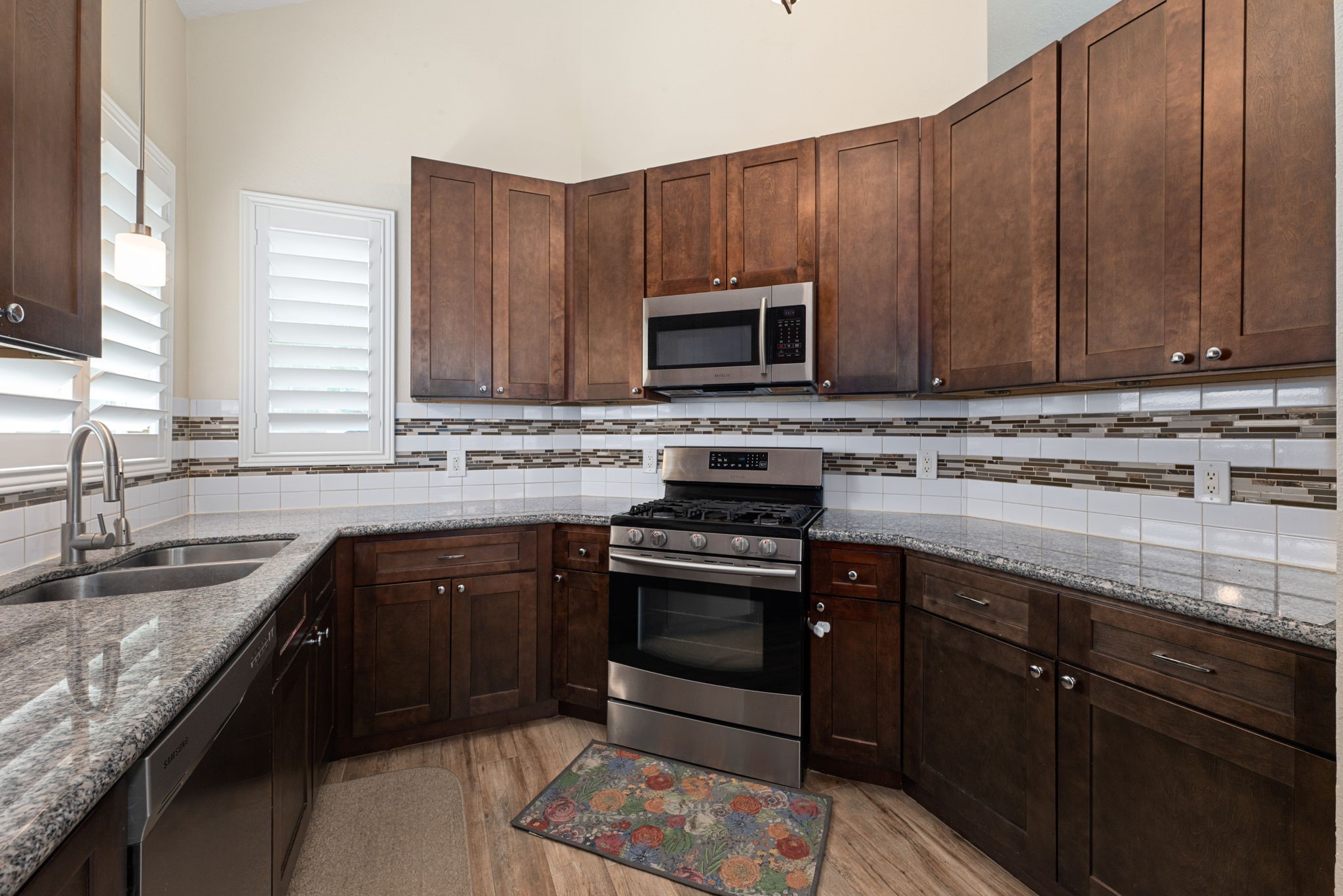 1915 Mercoal Drive Spring, TX 77386 - Photo 14 of 50 Spacious kitchen with wraparound countertops, ample storage, and a functional layout.