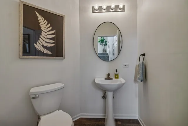 a bathroom with a toilet and a sink