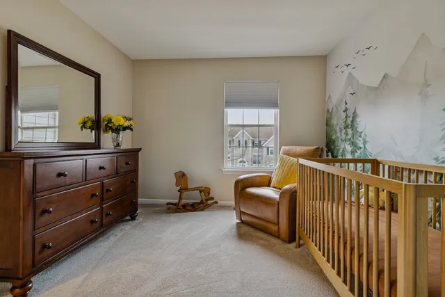 a bedroom with furniture and a window